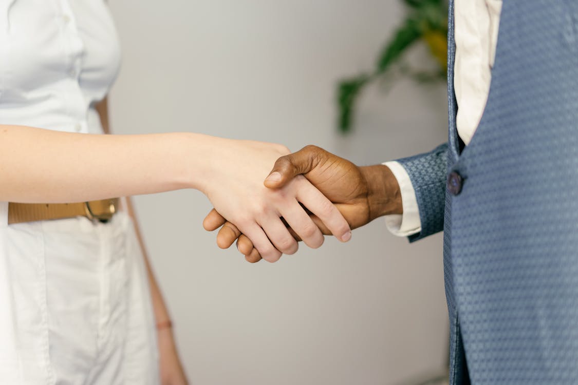 Handshake between business man and women